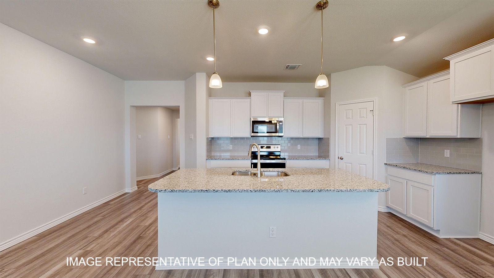 Dakota kitchen with white cabinets and granite countertops.