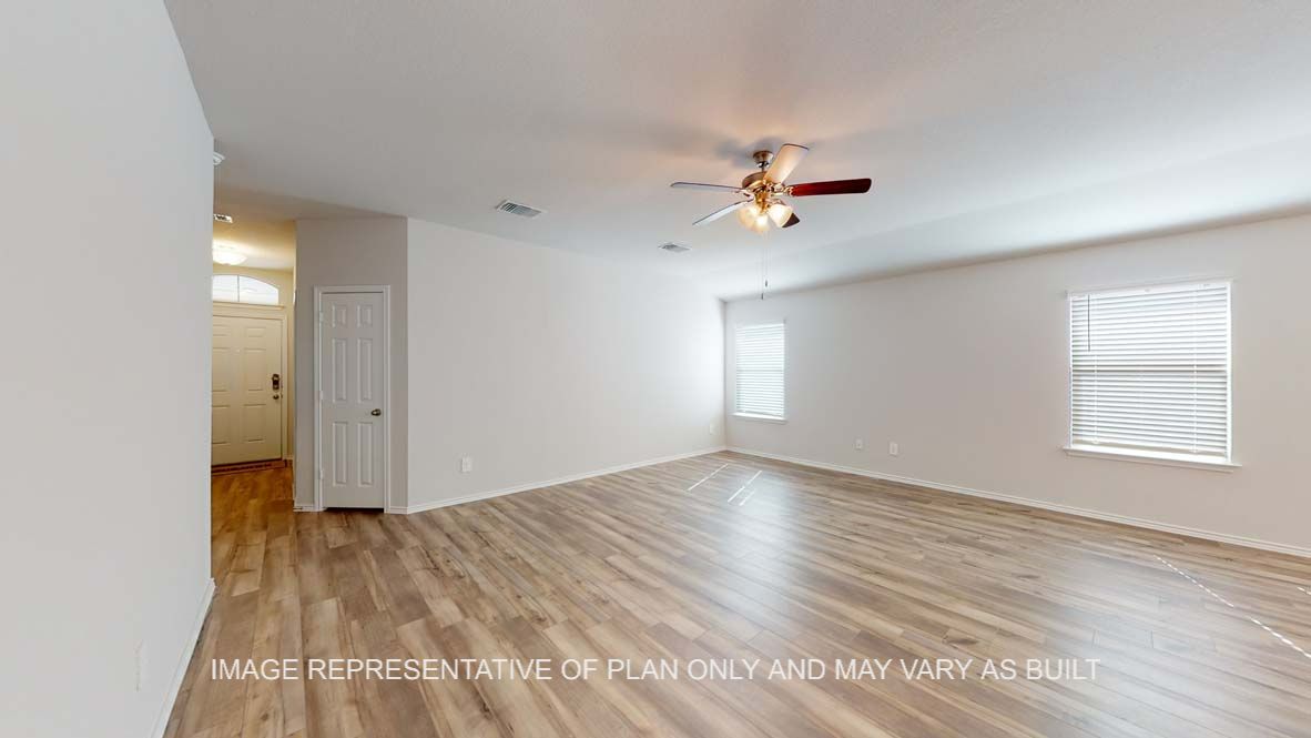 Roosevelt entry with vinyl plank flooring and windows offering natural light.