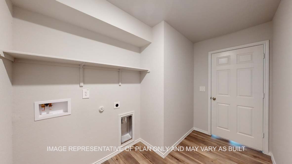 Roosevelt utility room with vinyl plank flooring and storage shelf.