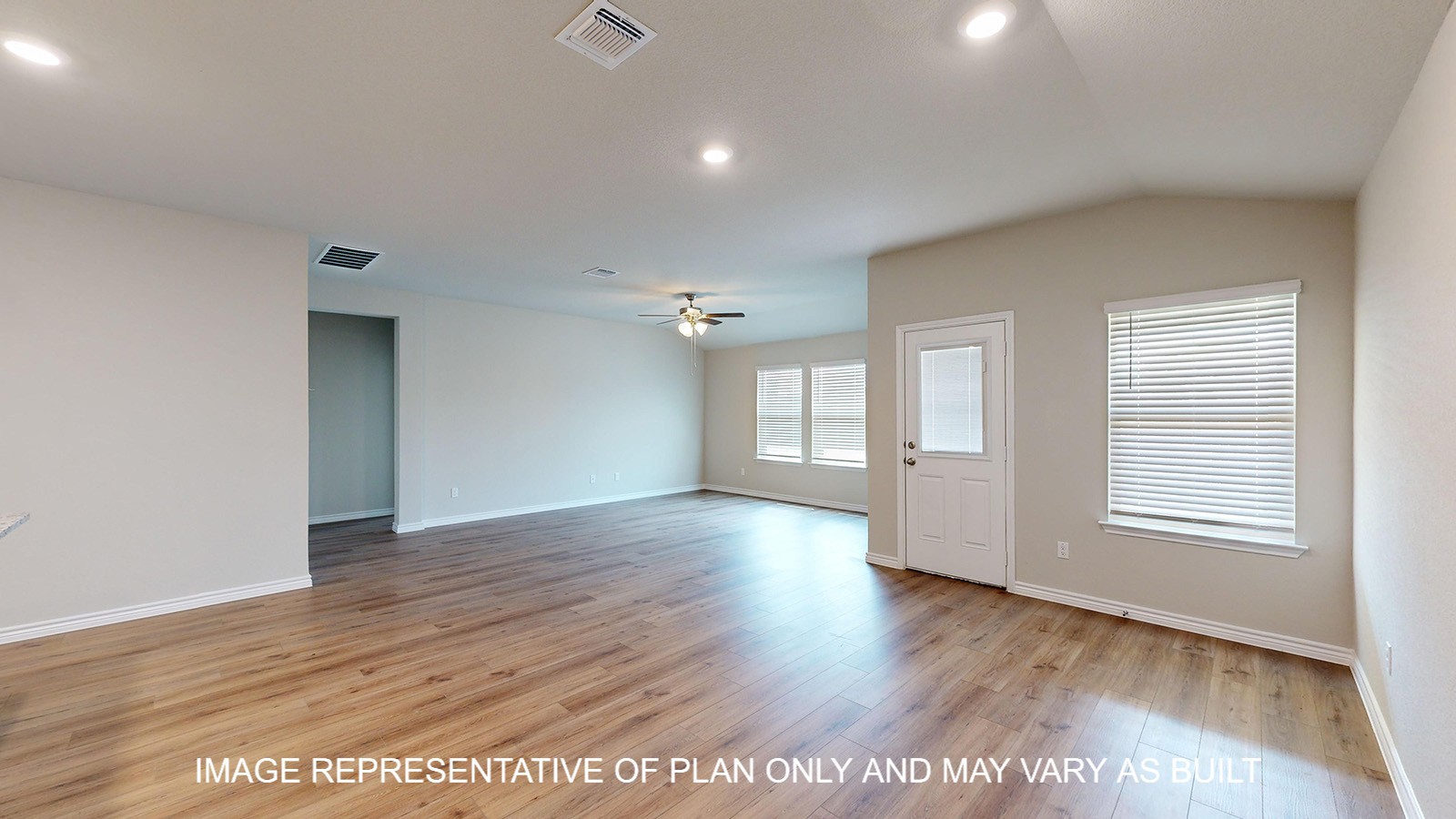 Monroe open concept living and dining room with vinyl plank flooring throughout.