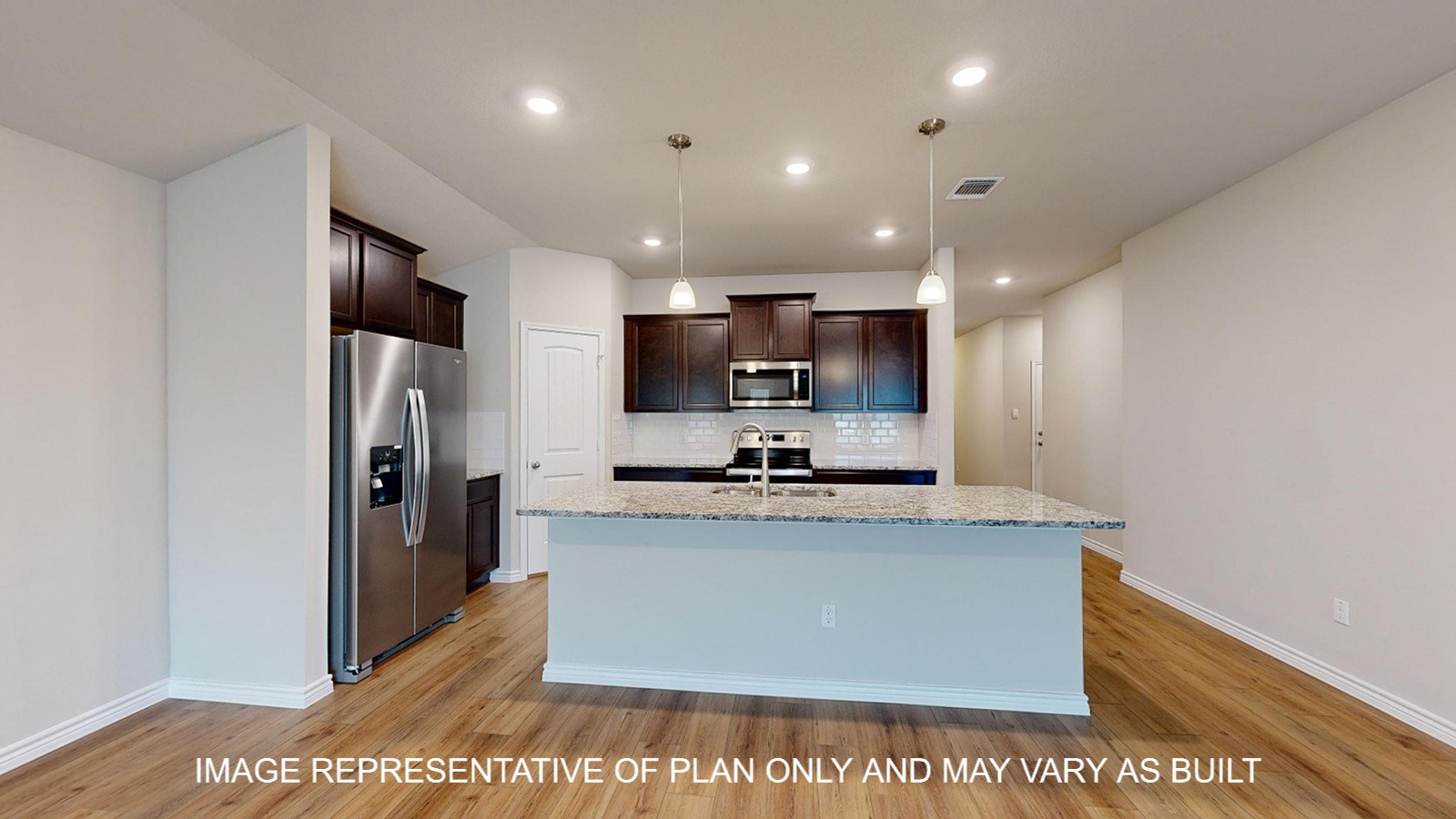 Monroe kitchen with dark cabinets and vinyl plank flooring and kitchen island.