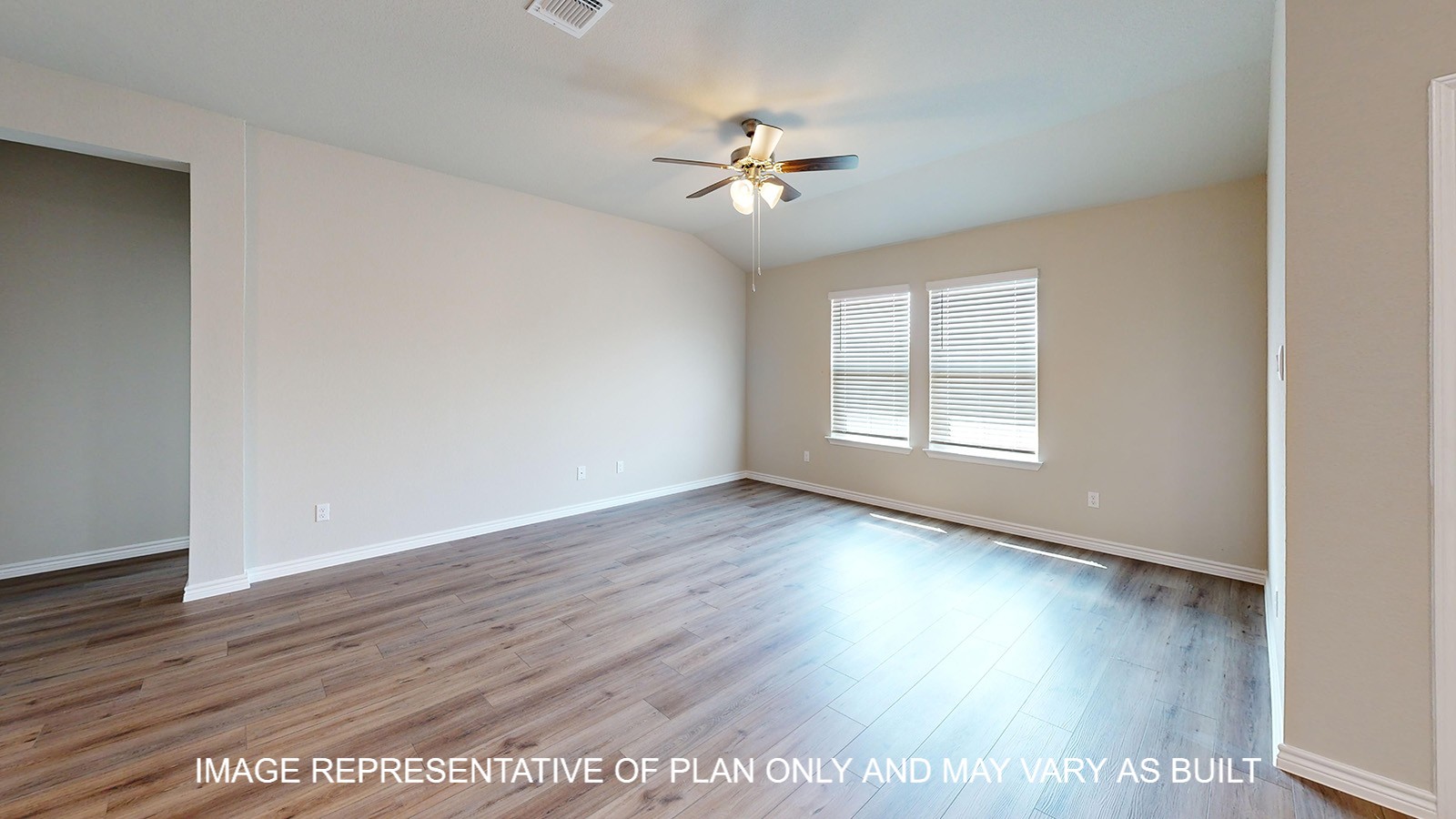 Monroe living room with vinyl plank flooring and windows for natural lighting.