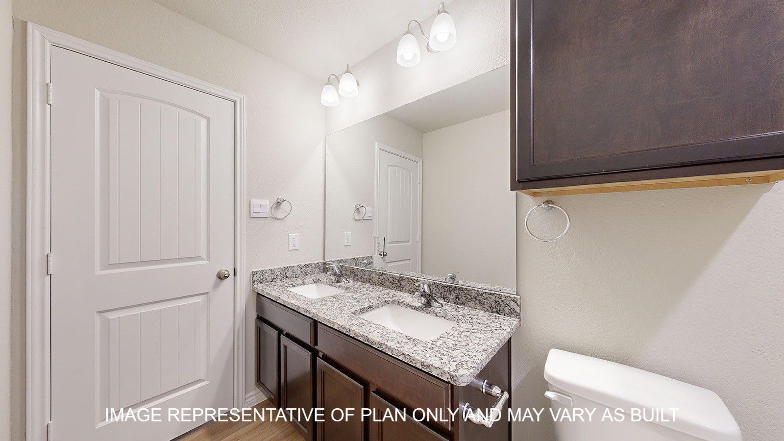 Monroe secondary bathroom with dark cabinets and granite countertops.