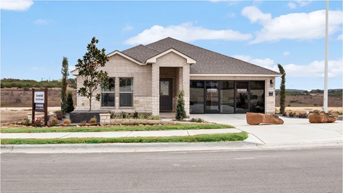 Creekfall model home exterior elevation with glass store front windows.