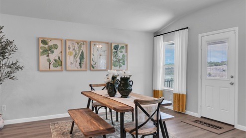 Creekfall model home dining room with view of the back door.