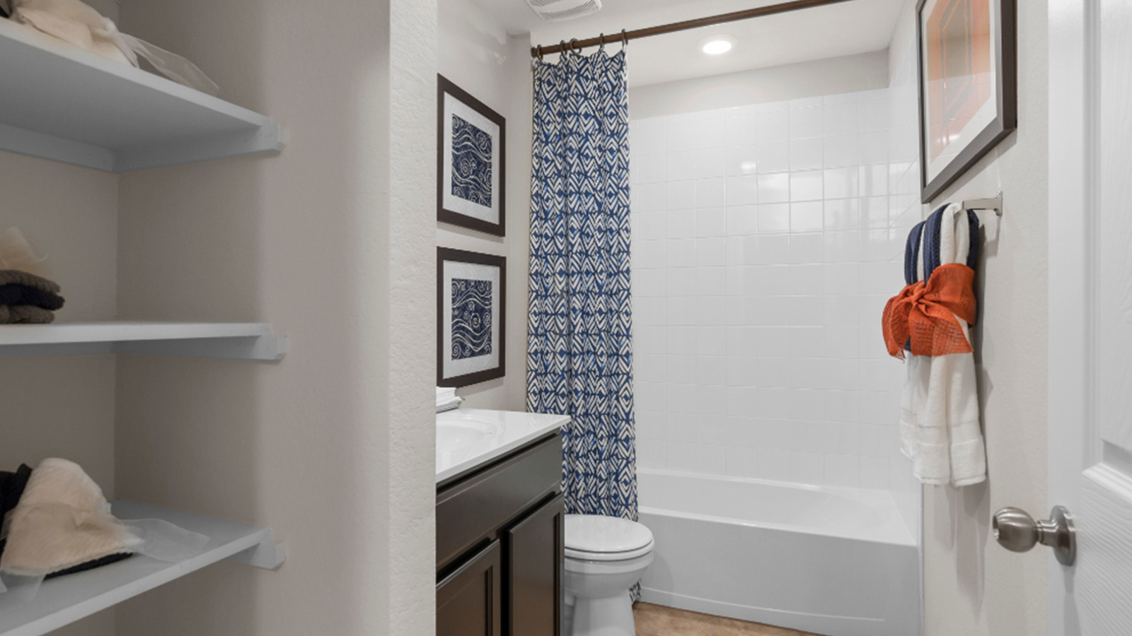 Yowell Ranch Model Home secondary bathroom with vanity sink and shower and tub combo.