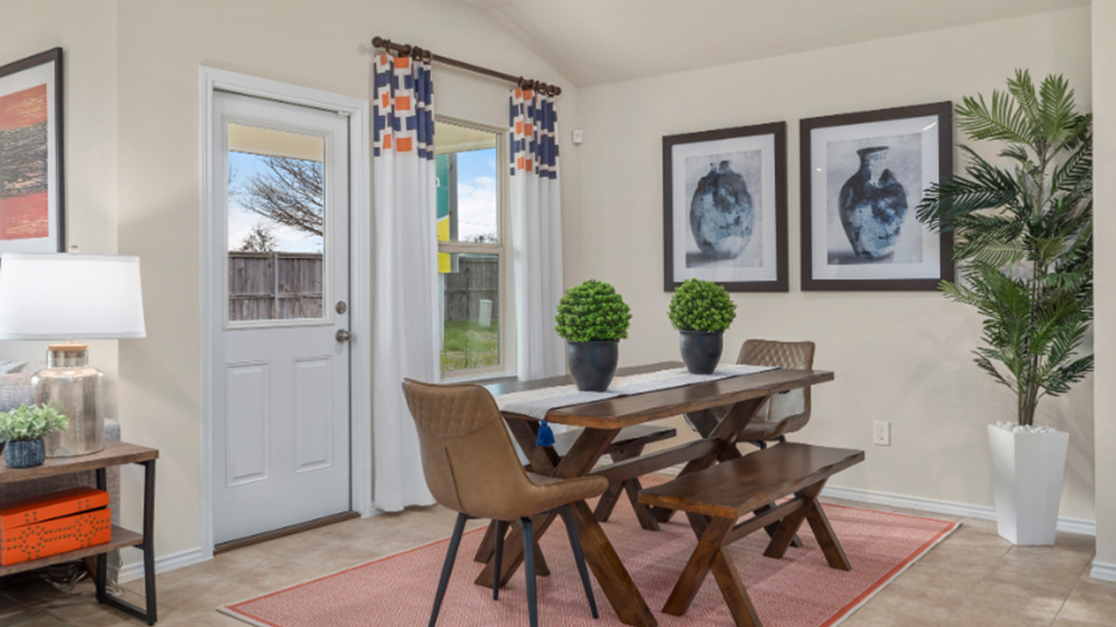 Yowell Ranch Model Home dining room with dining room table and view of back yard.