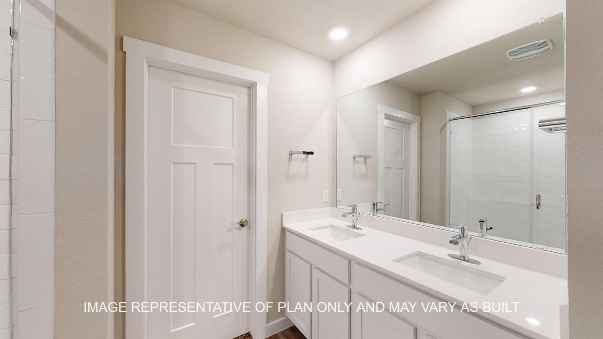 Caden primary bath with dual vanities.