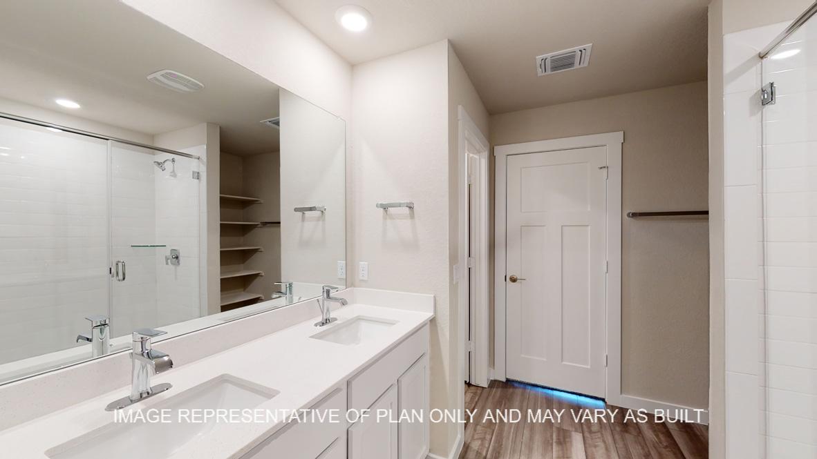 Caden primary bath with dual vanities.