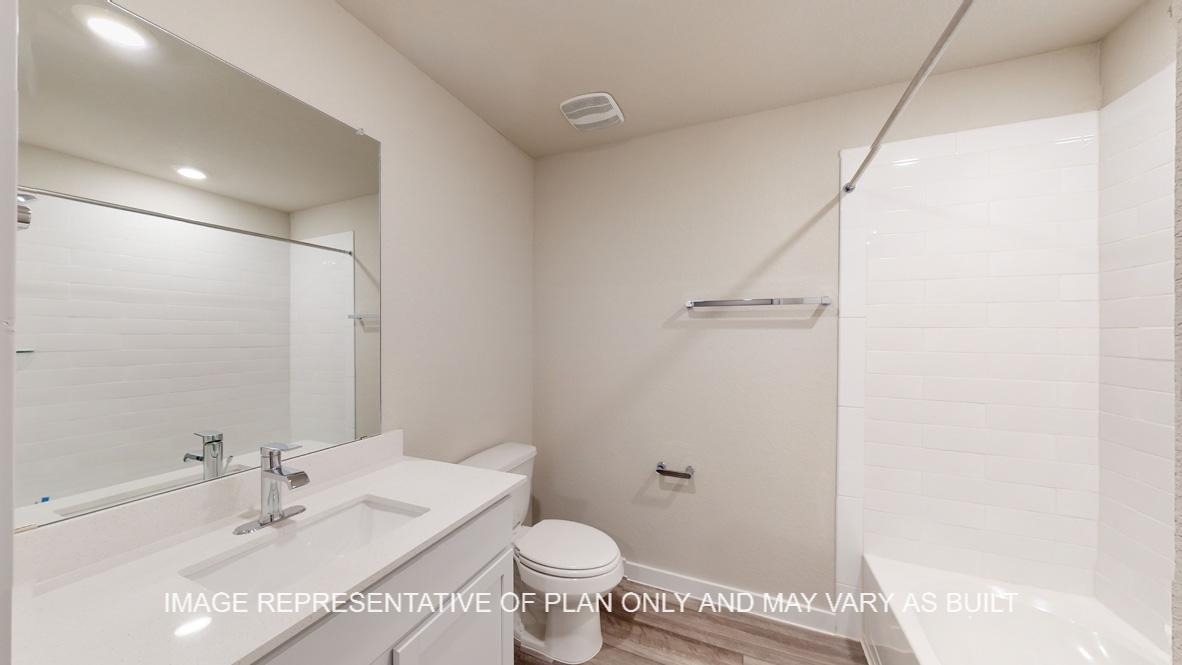 Caden bath two with white cabinets and countertops.