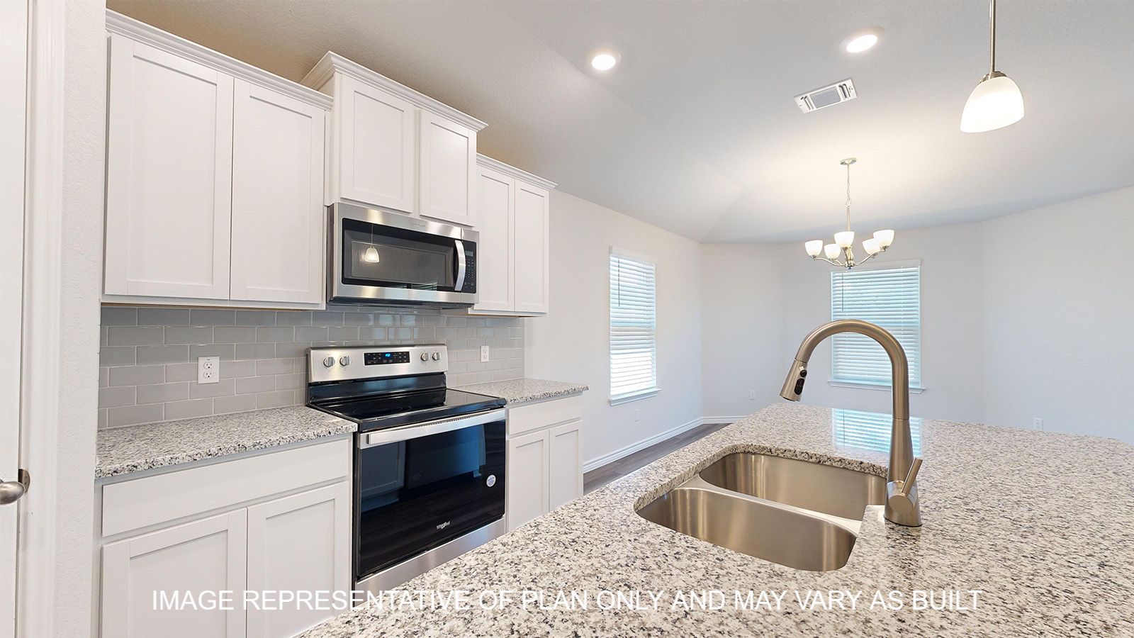 Alpine kitchen center island with granite countertops and undermount sink.