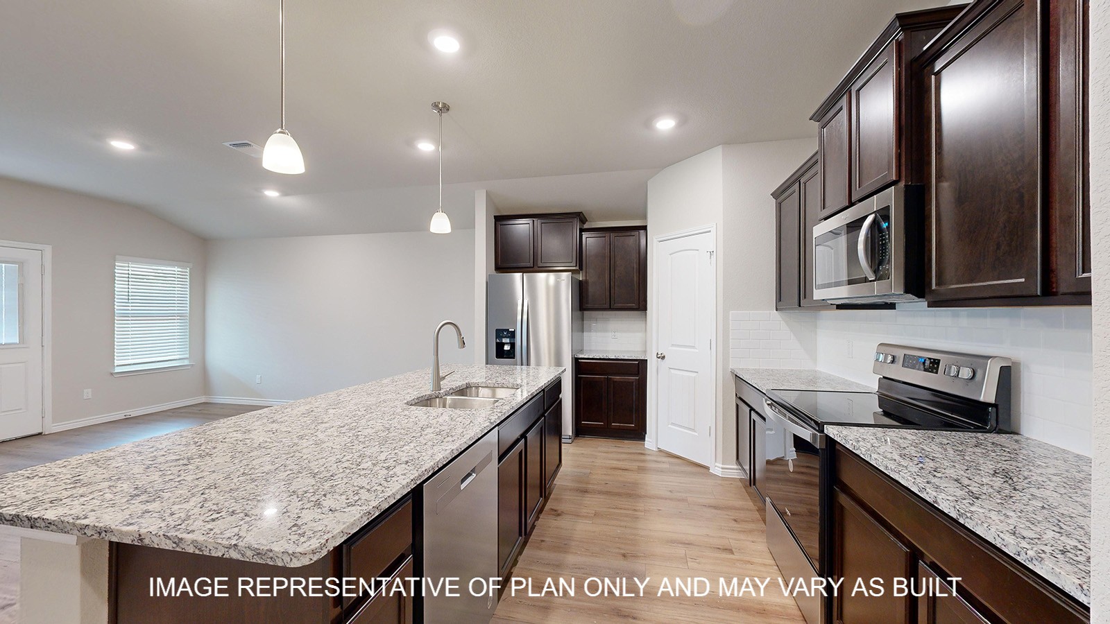 Monroe kitchen with granite countertops and dark cabinets.