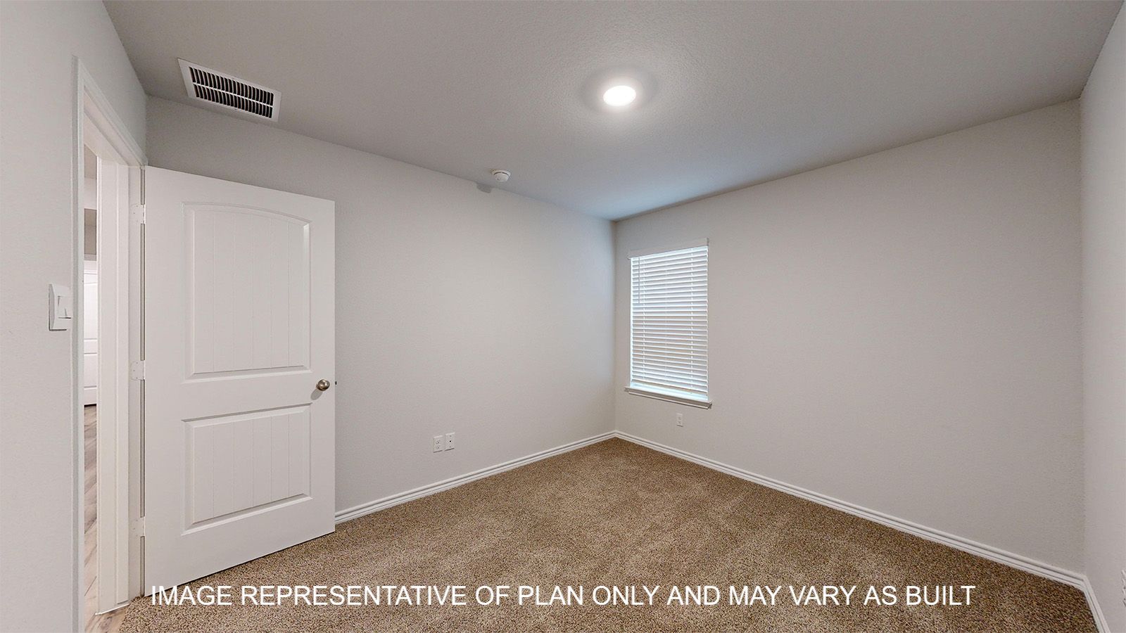 Everett secondary bedroom with carpet flooring and closet door.