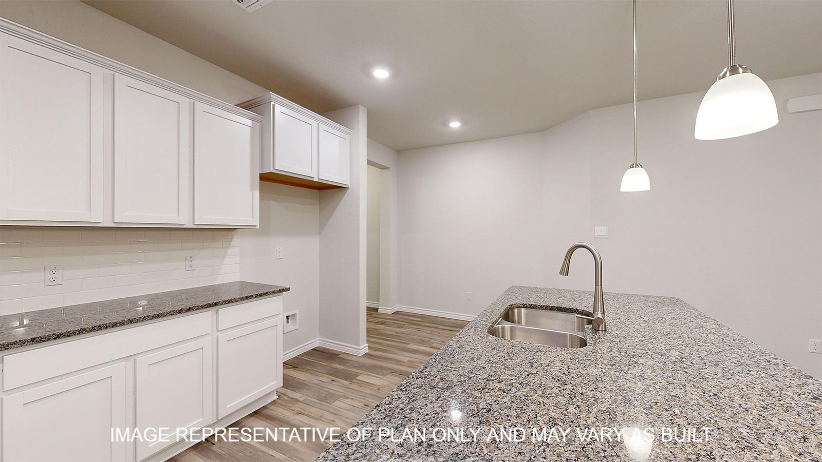Everett kitchen with vinyl plank flooring and pendant light fixtures over kitchen island.