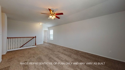 Aspen upstairs game room with carpet flooring.