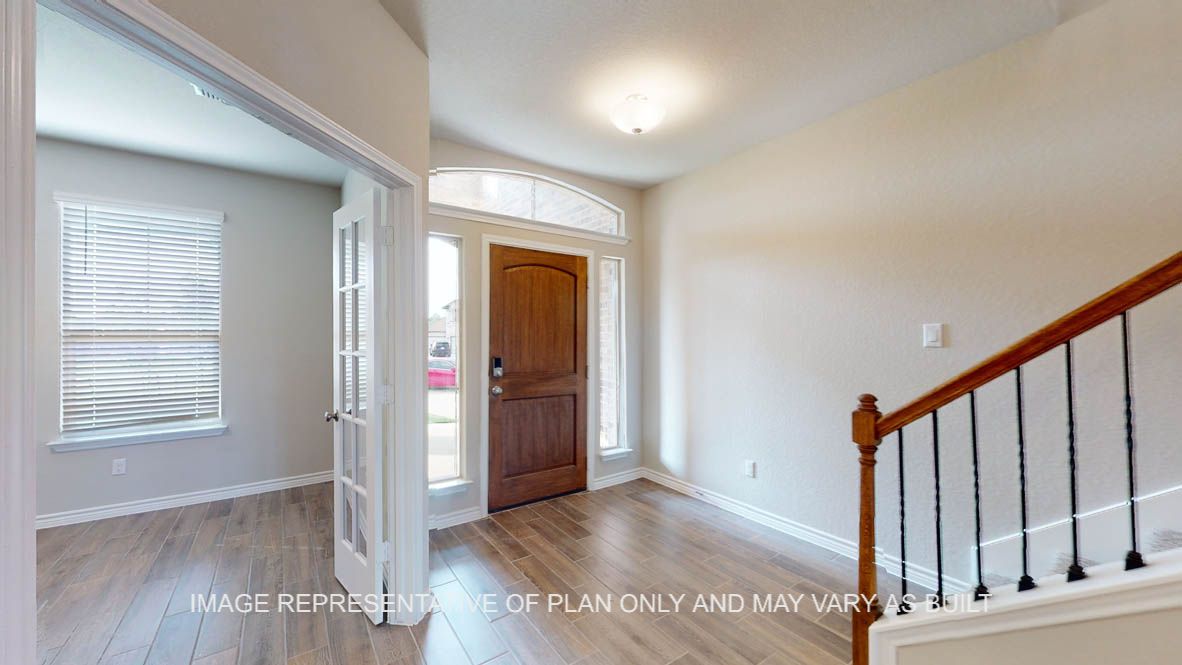 Kiawa view of front door entry and into the study with french doors.