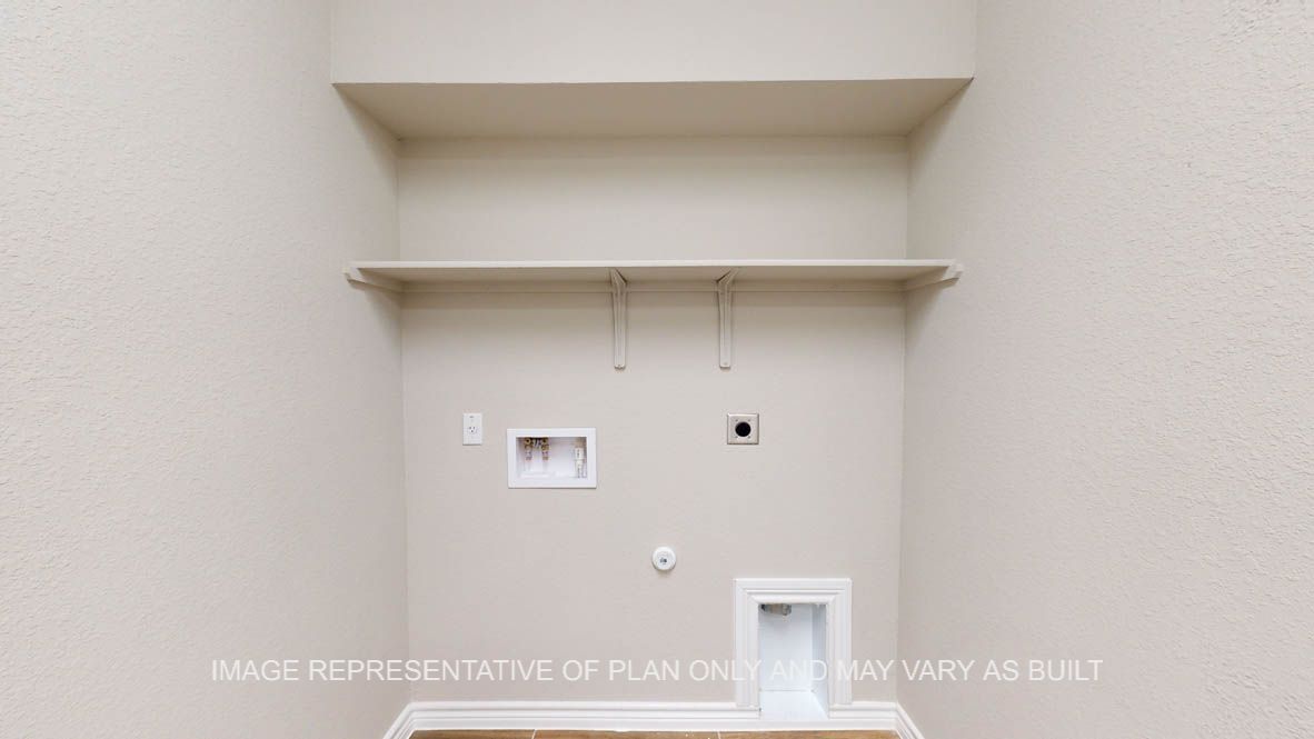 Kiawa utility room with storage shelves.
