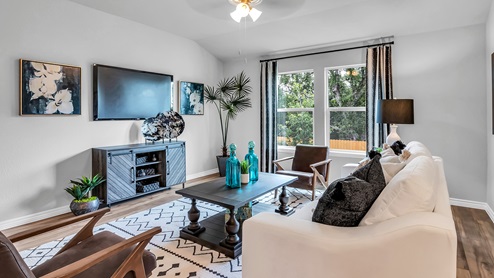Three Creeks Colt Creek model home living room with a view of the backyard.