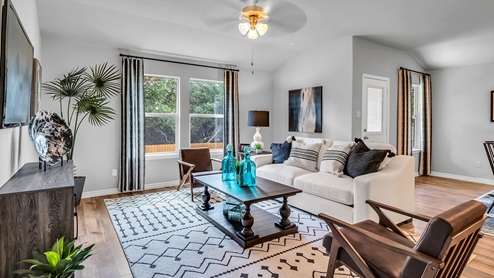 Three Creeks Colt Creek model home living room with view of the back door.