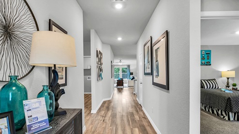 Three Creeks Colt Creek model home entry hallway with view of living room.