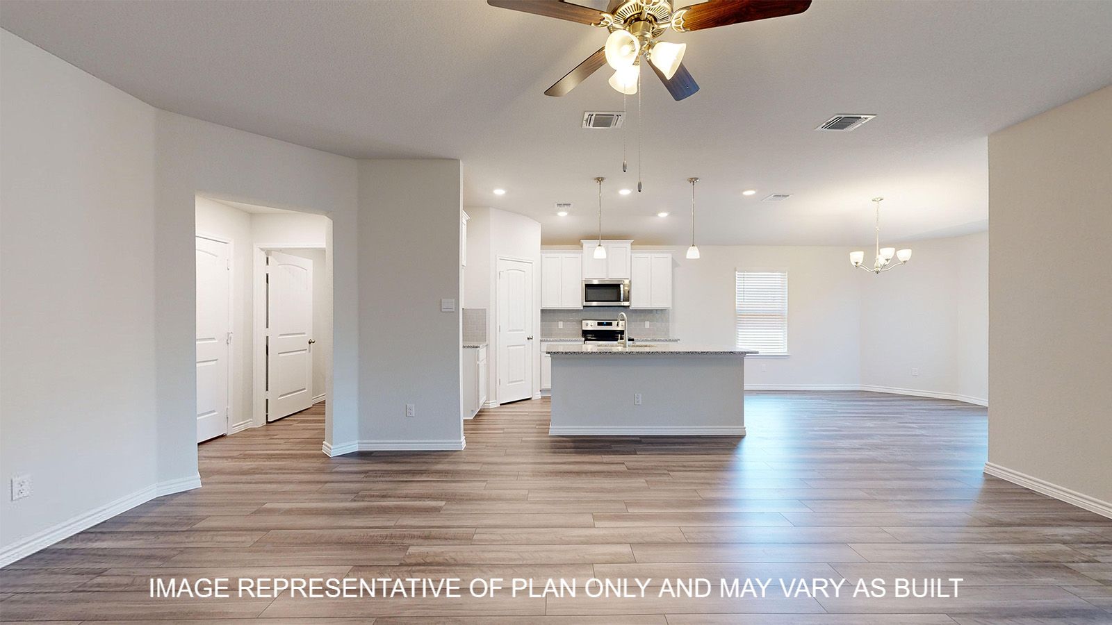 Alpine living room with view into kitchen and dining room.