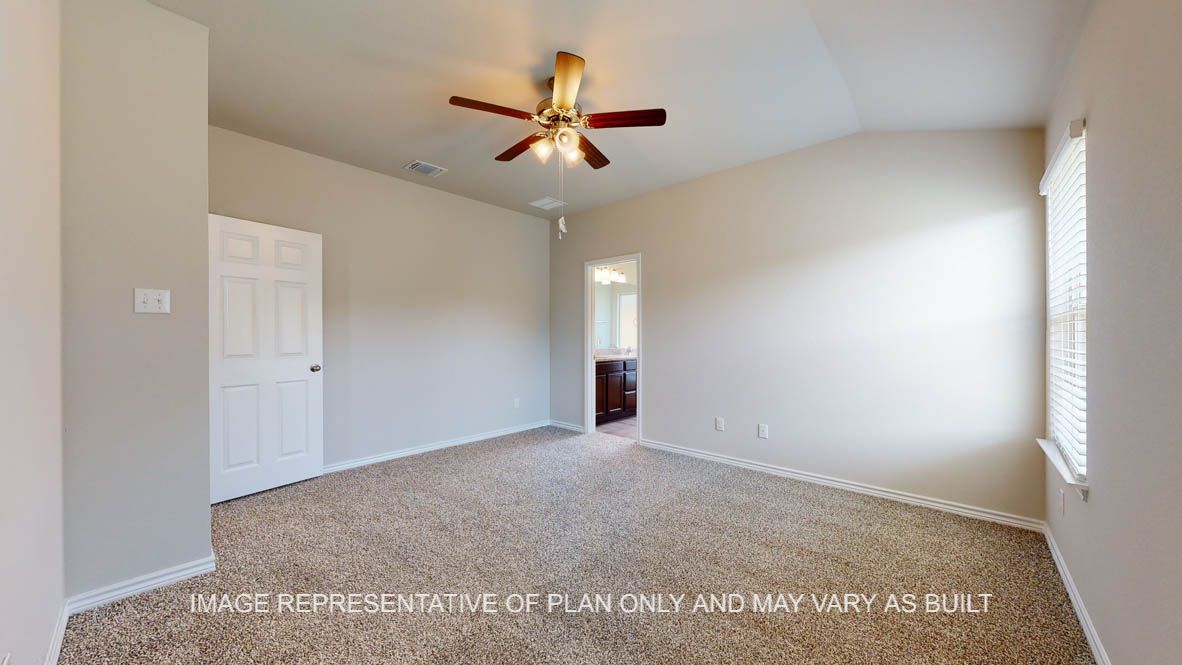Richmond primary bedroom with carpet flooring and ceiling fan.