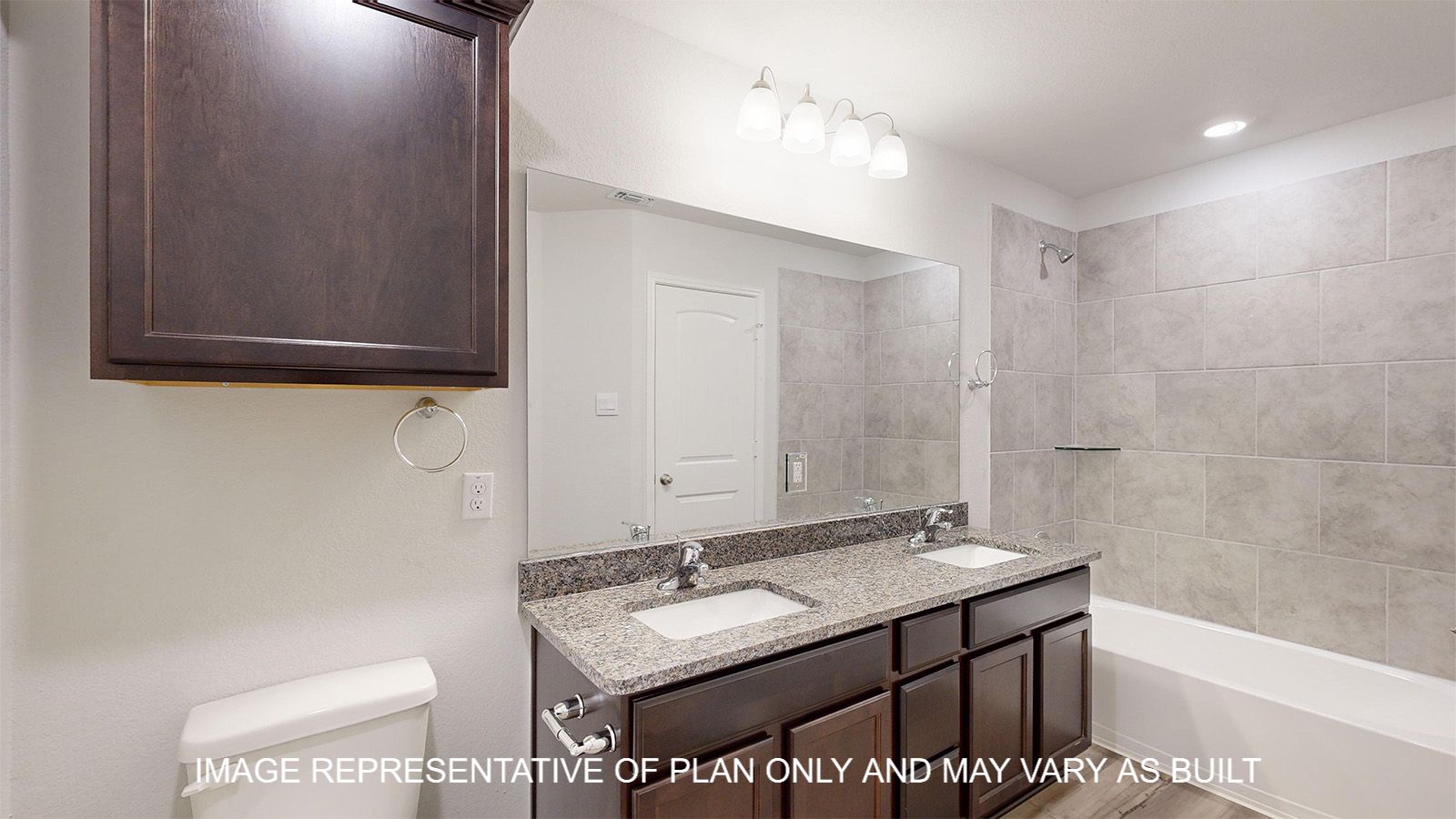 Everett secondary bathroom with dark cabinets and granite countertops.