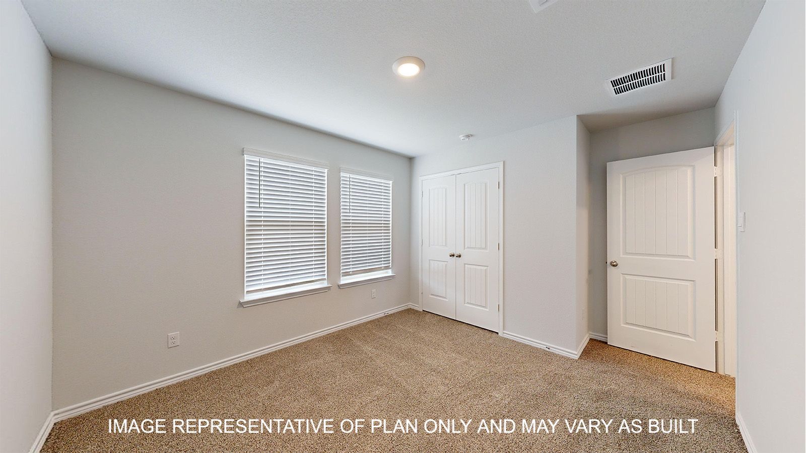 Magnolia secondary bedroom with carpet flooring and window.