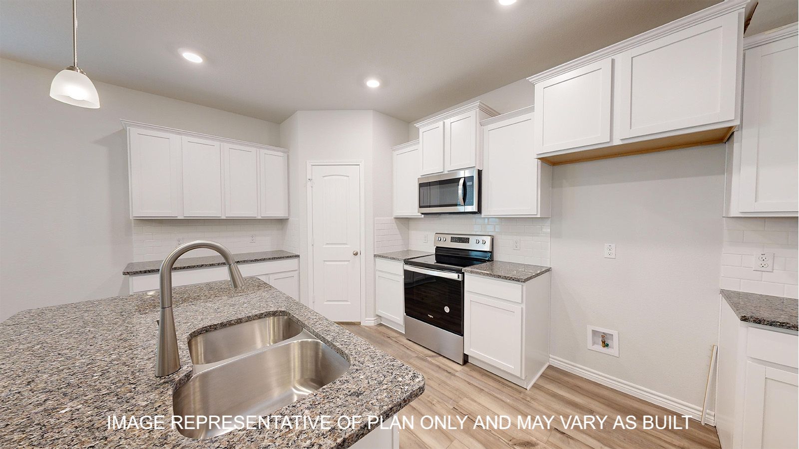 Magnolia kitchen with center kitchen island with undermount sink.