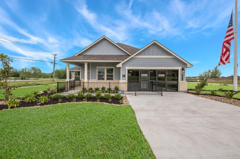 Foxborough model home exterior elevation with glass store front windows.