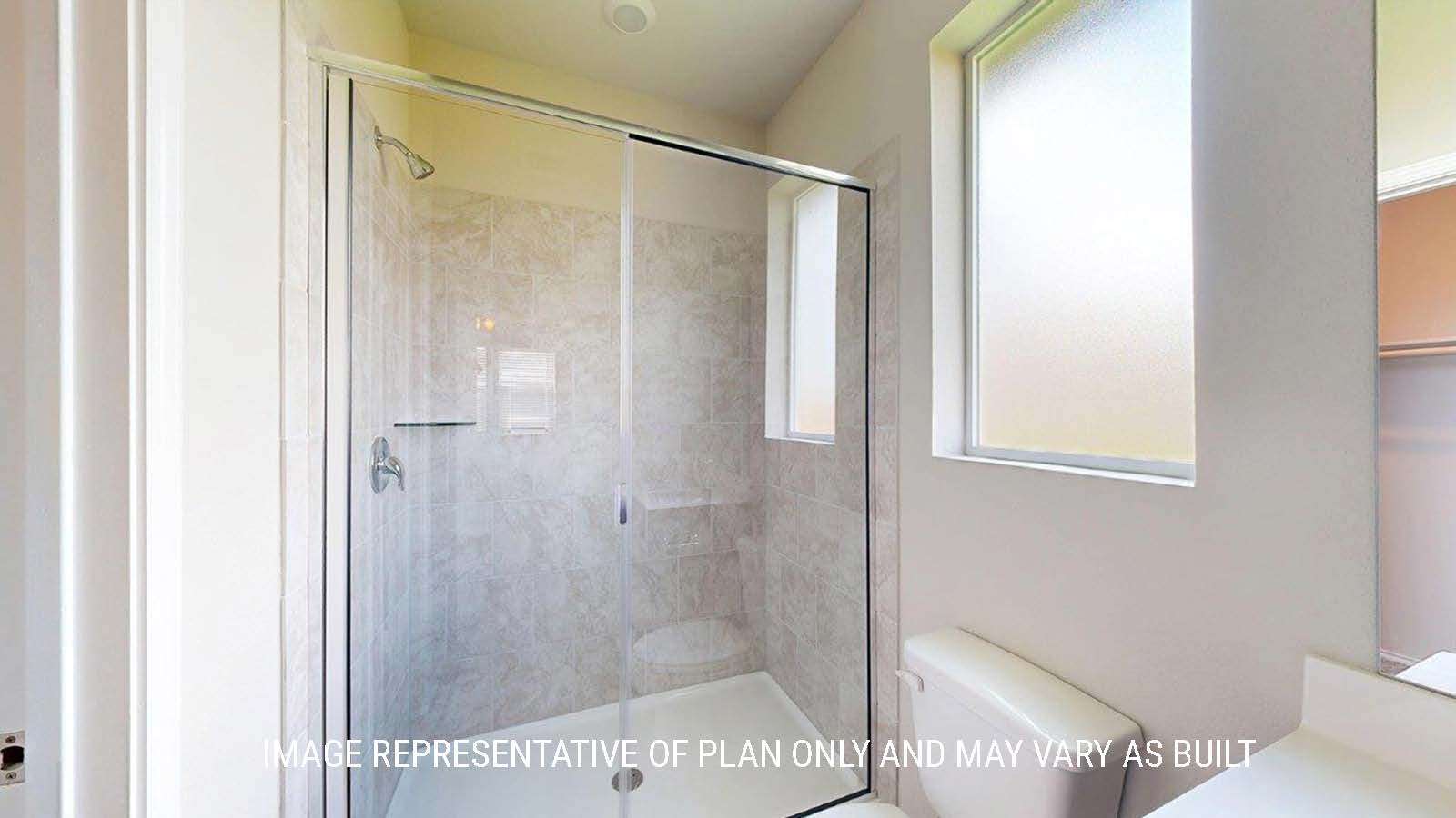 1402 Primary bathroom with walk-in shower and granite tile.