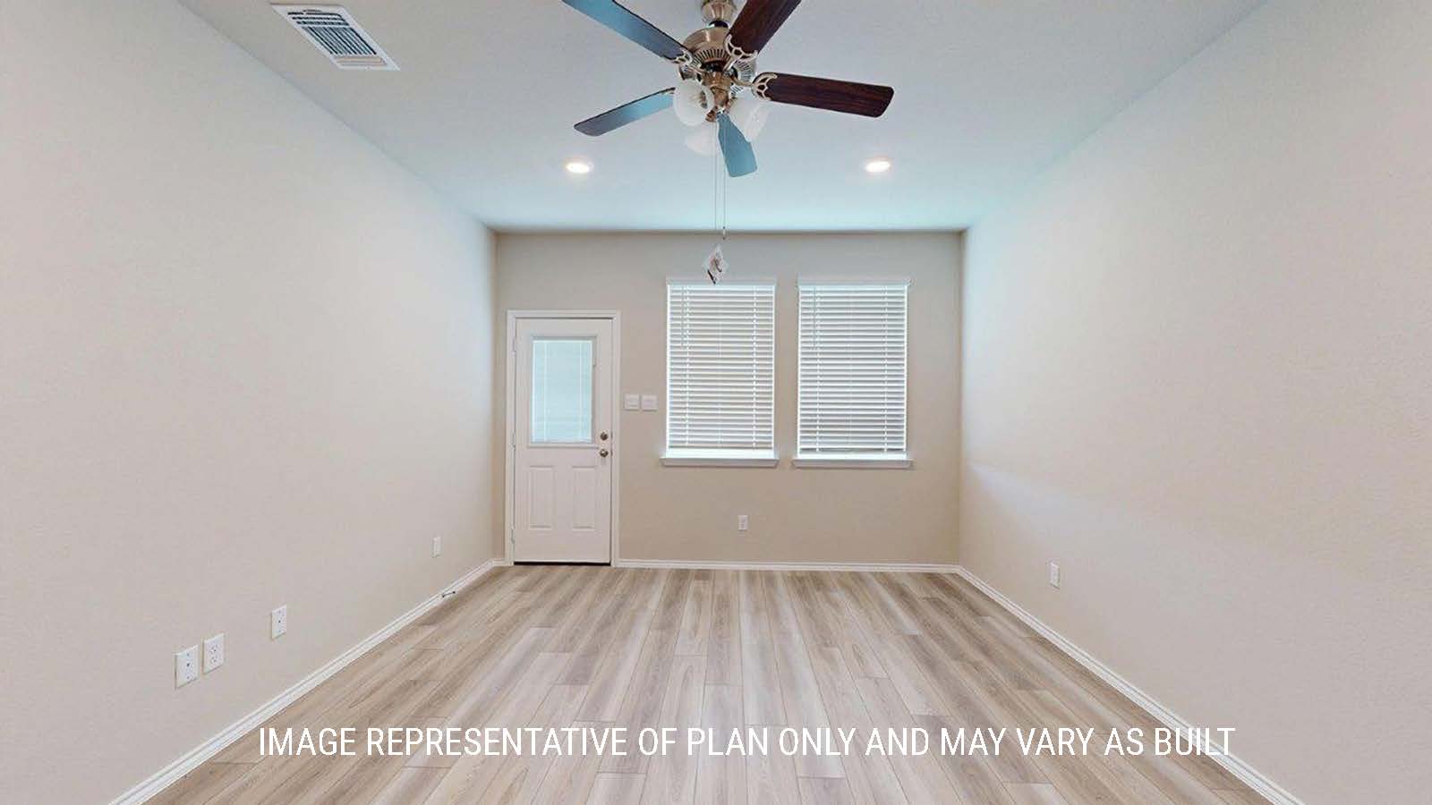 1402 Family room with double windows and view of the back door.