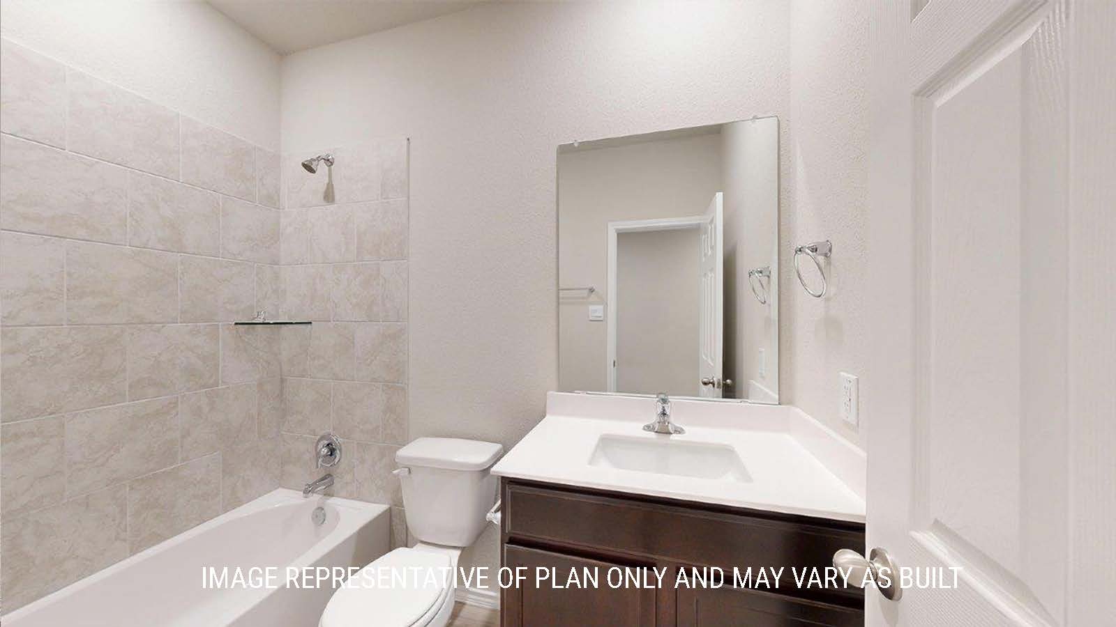 1402 Secondary bathroom with vanity sink and shower and tub combo.