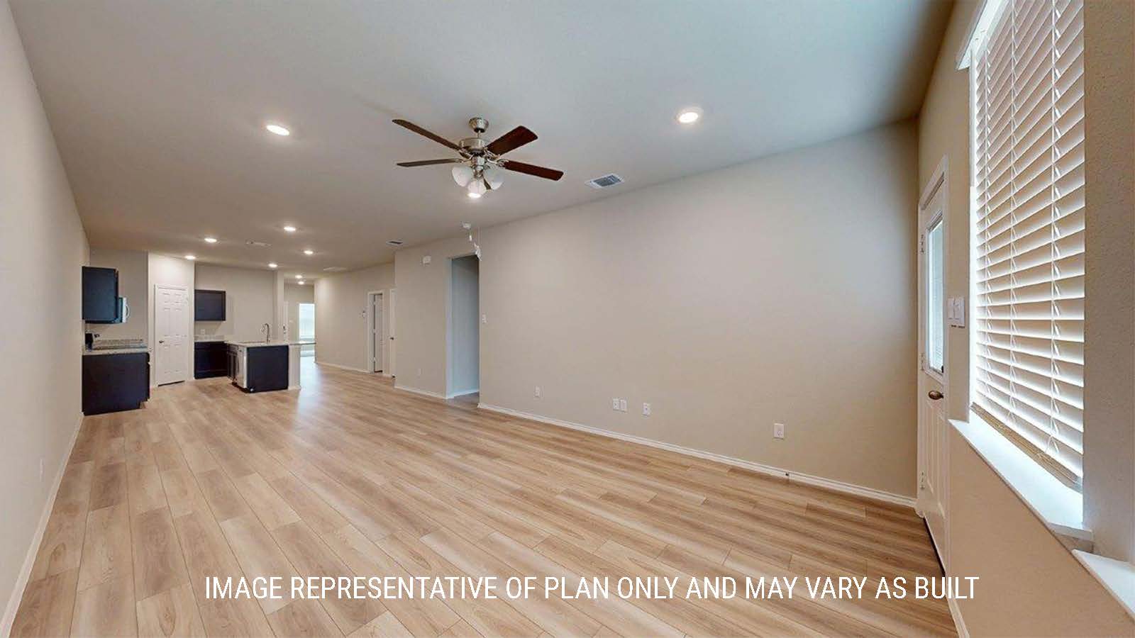 1402 Family room with vinyl flooring and view of the kitchen.