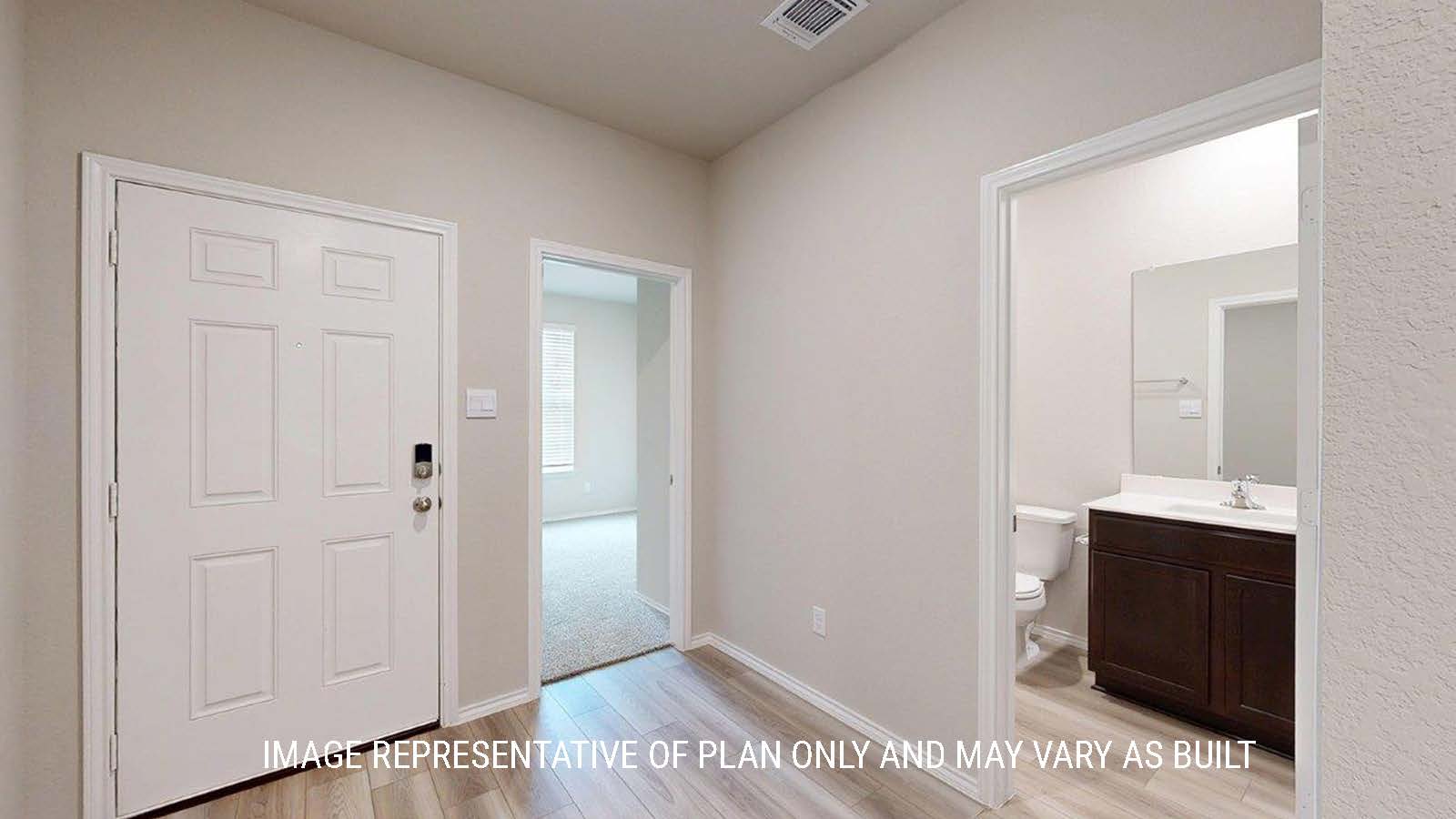 1402 Entry way with view of secondary bedroom and secondary bathroom.
