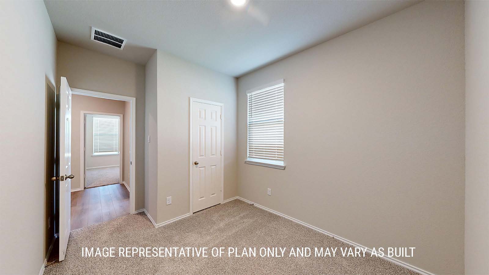 1530 Secondary bedroom with carpet flooring and closet.