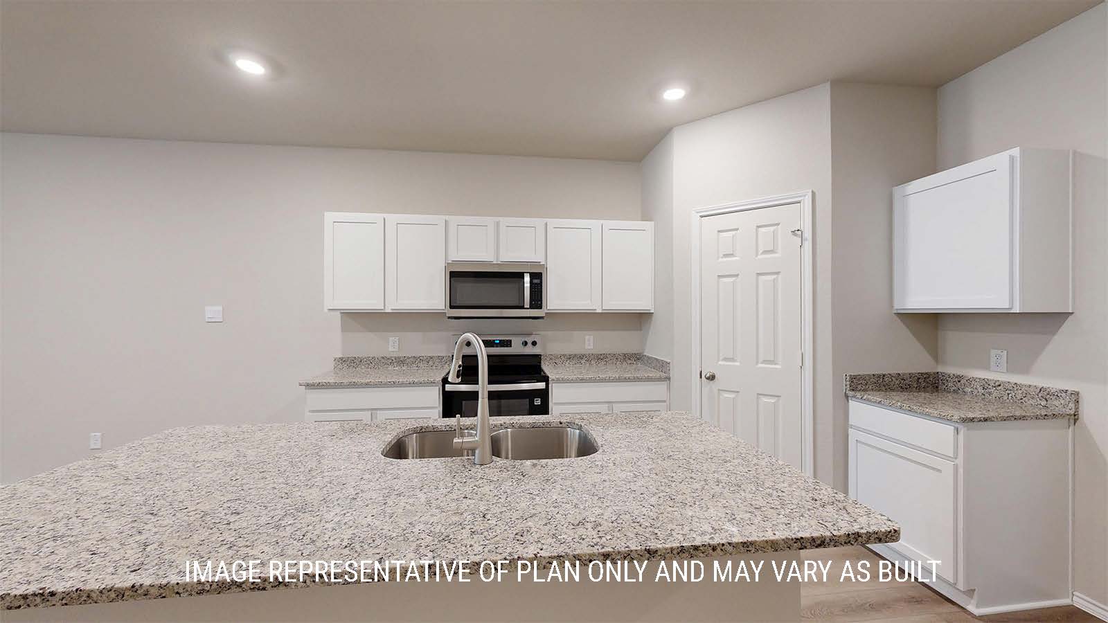 1530 Kitchen with white cabinets and granite countertops.