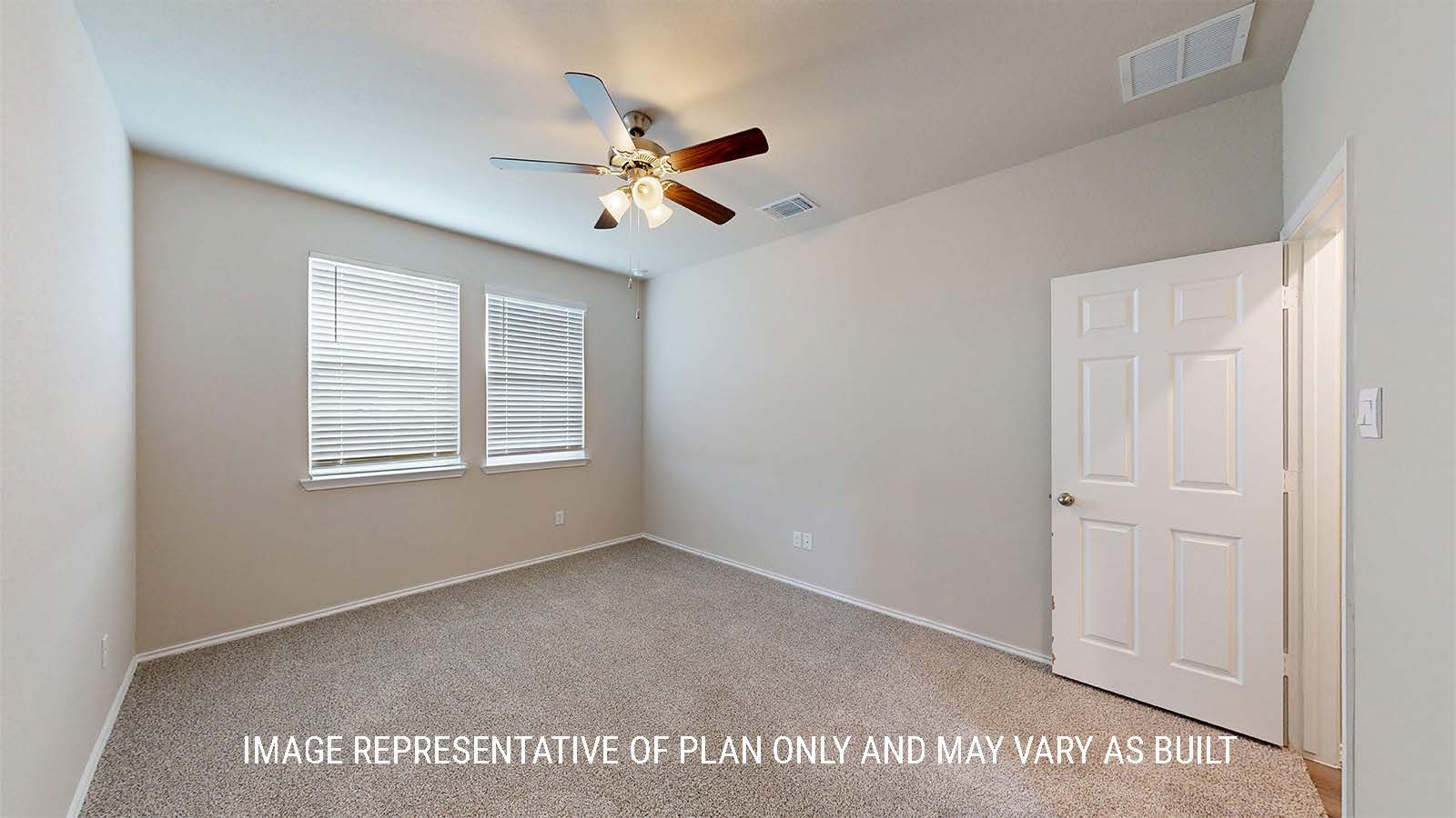 1530 Primary bedroom with carpet flooring and windows.
