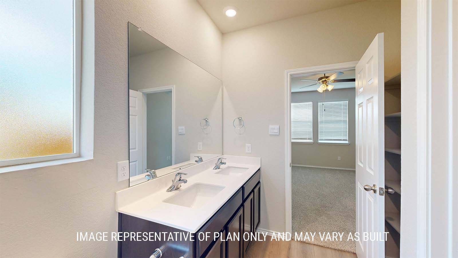 1530 Primary bathroom with duel vanity sinks with granite countertops.