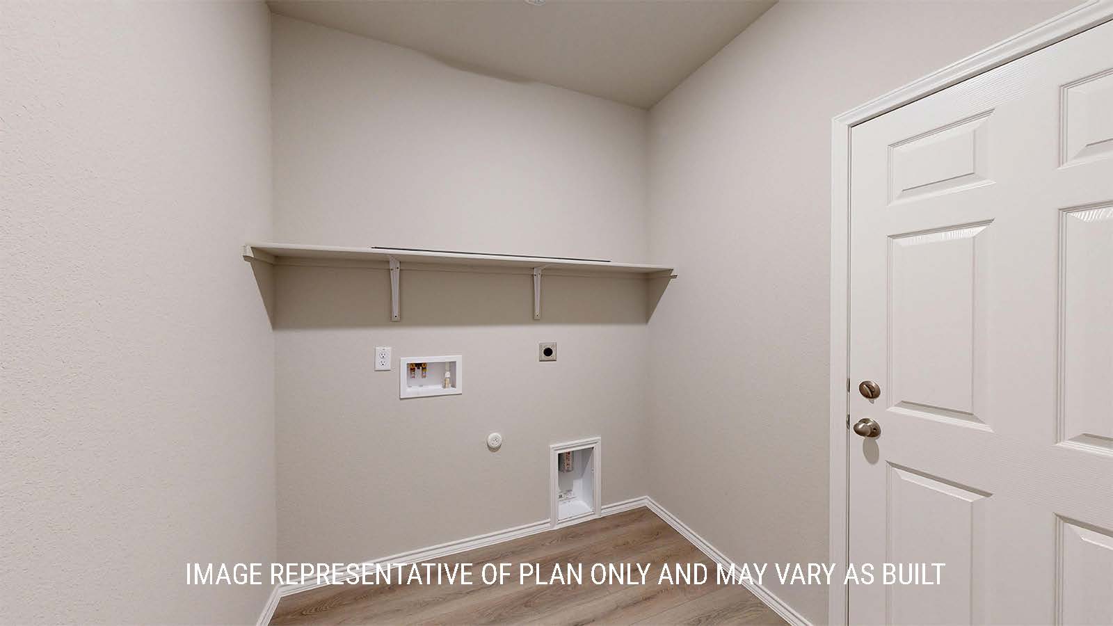 1530 Utiltiy room with washer and dryer connections and shelving.