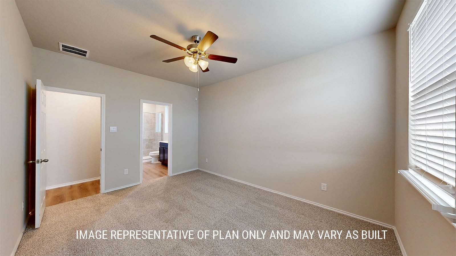 1530 Primary bedroom with carpet flooring and view of primary bathroom.