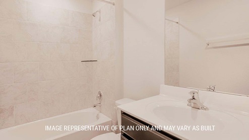 Schwertner Ranch model home secondary bathroom with single vanity and shower and tub combo.