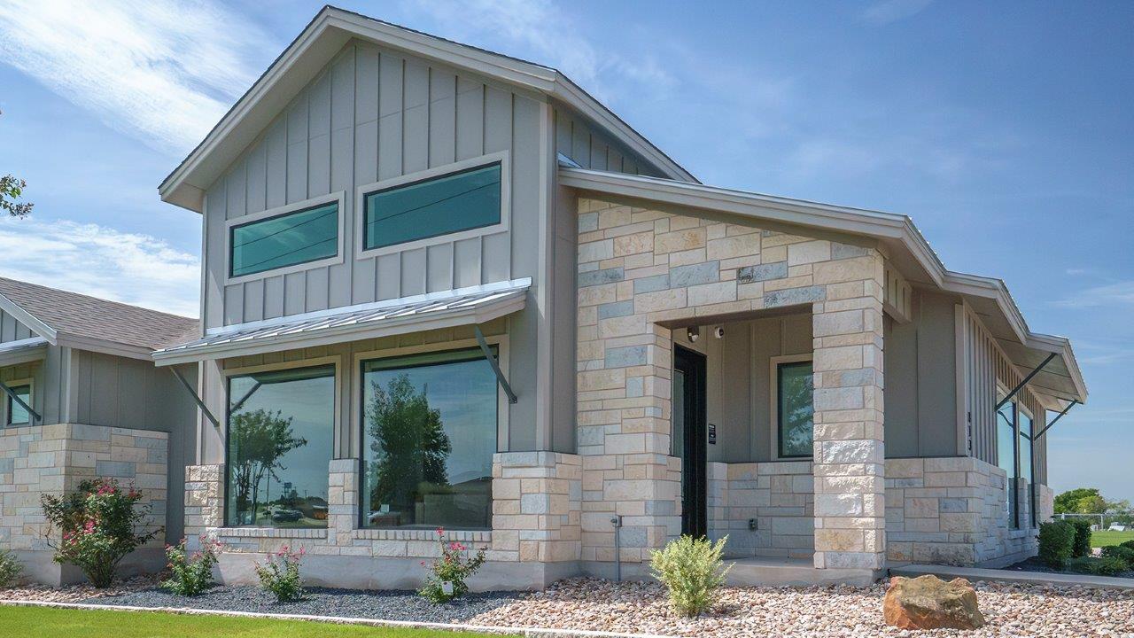 Schwertner Ranch Model Sales Office Front Exterior View of Front Door and Windows.