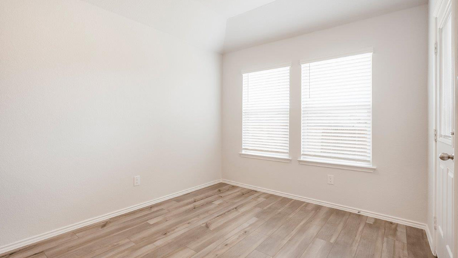 Schwertner Ranch dining room with view of kitchen and back door.
