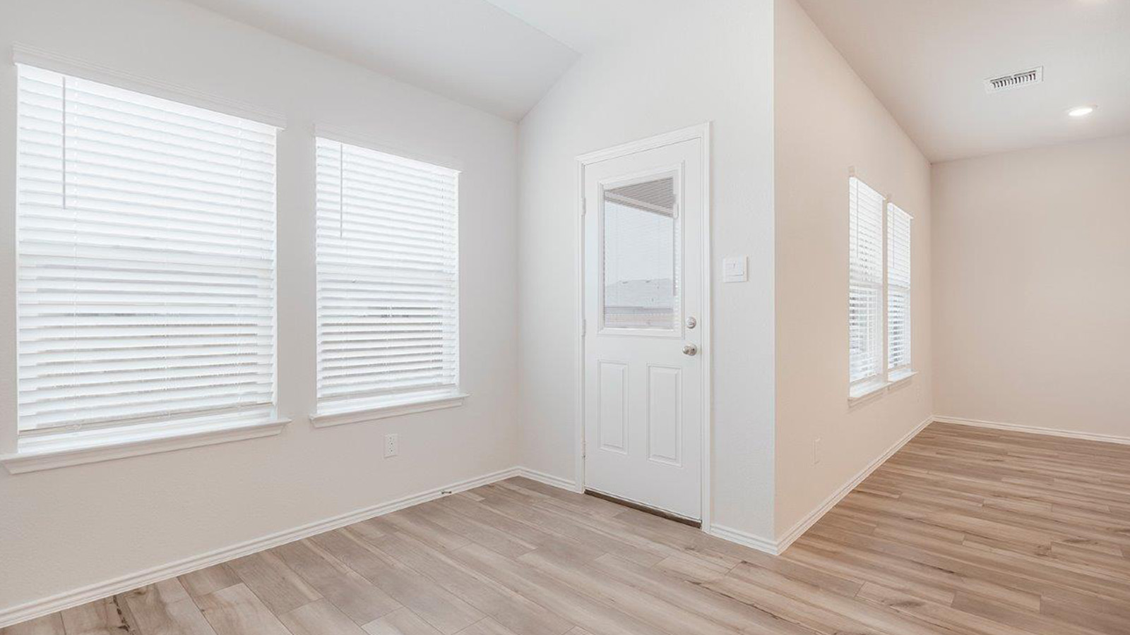 Schwertner Ranch dining room with view of kitchen and back door.