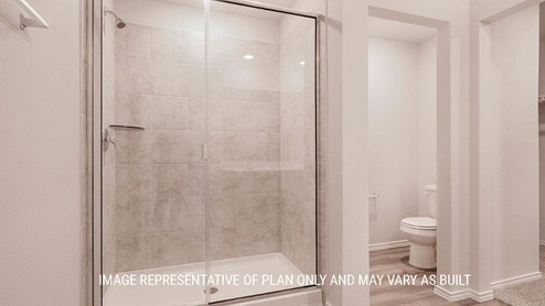 Schwertner Ranch model home primary bathroom with walk-in shower.