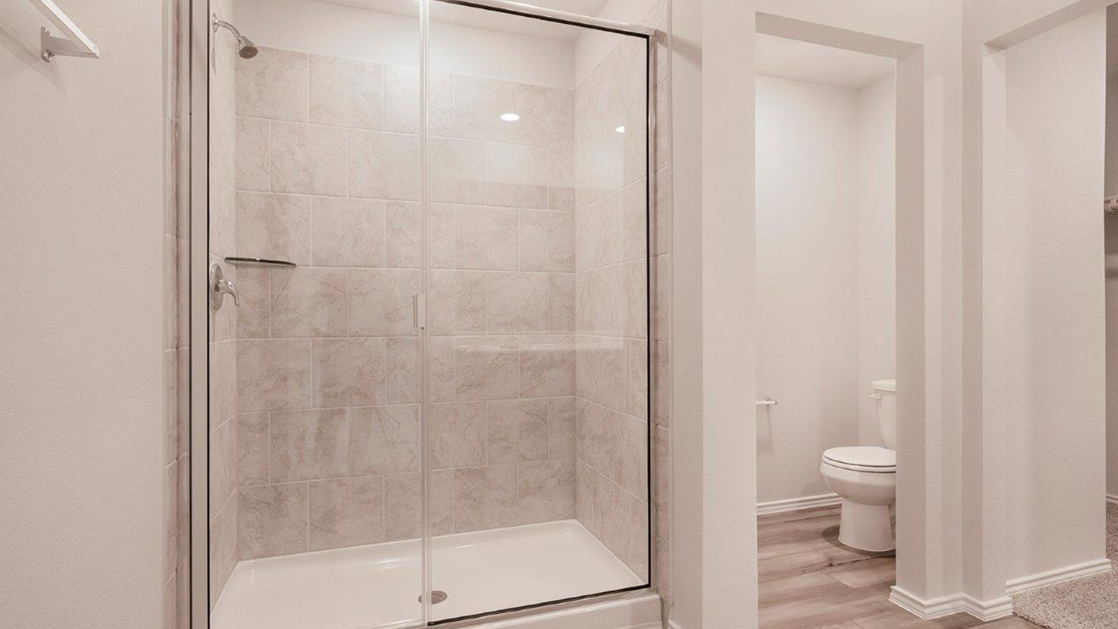 Schwertner Ranch primary bathroom with walk-in shower.