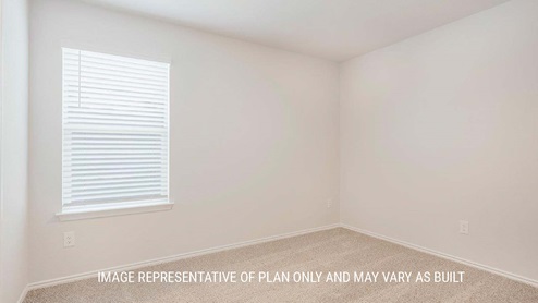 Schwertner Ranch model home secondary bedroom with carpeted flooring and window.