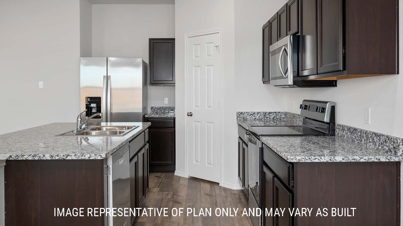 Bellvue kitchen with granite countertops and dark cabinets.