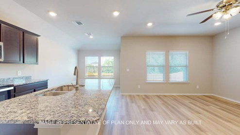 Bellvue open concept kitchen and living room with vinyl plank throughout.